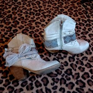 Cute tan and brown boots worn a handful of times.